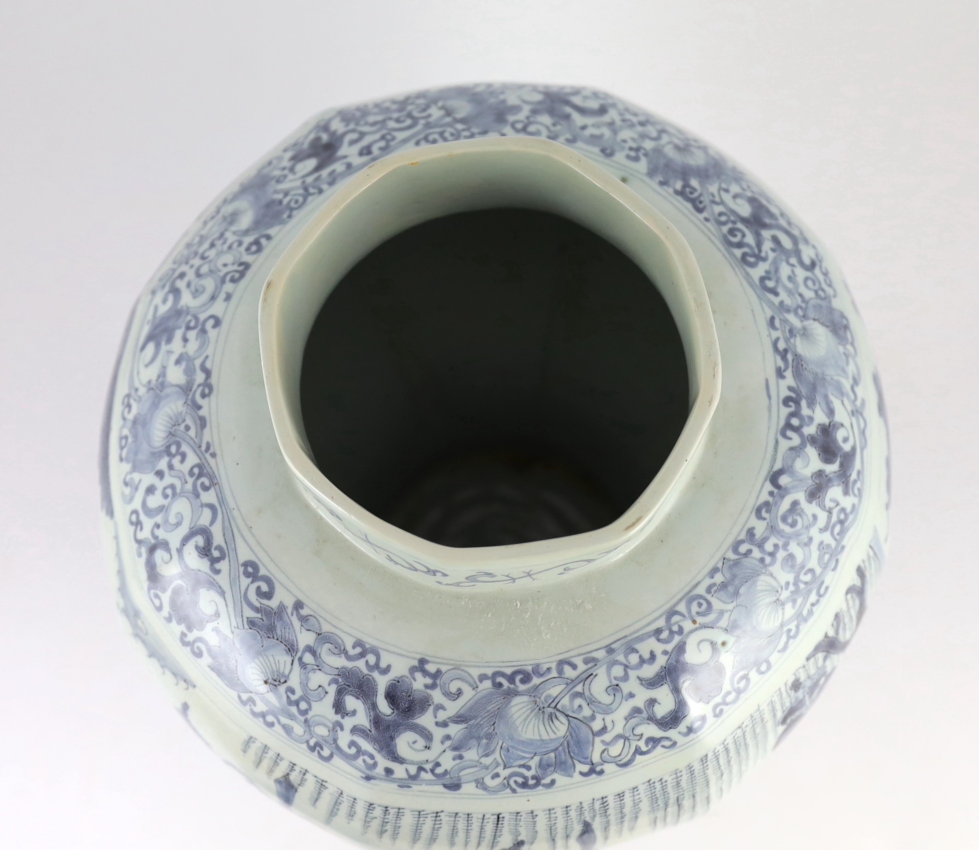 A massive Delft blue and white inverted baluster vase and cover, c.1700, 57.5cm high, neck and cover restored